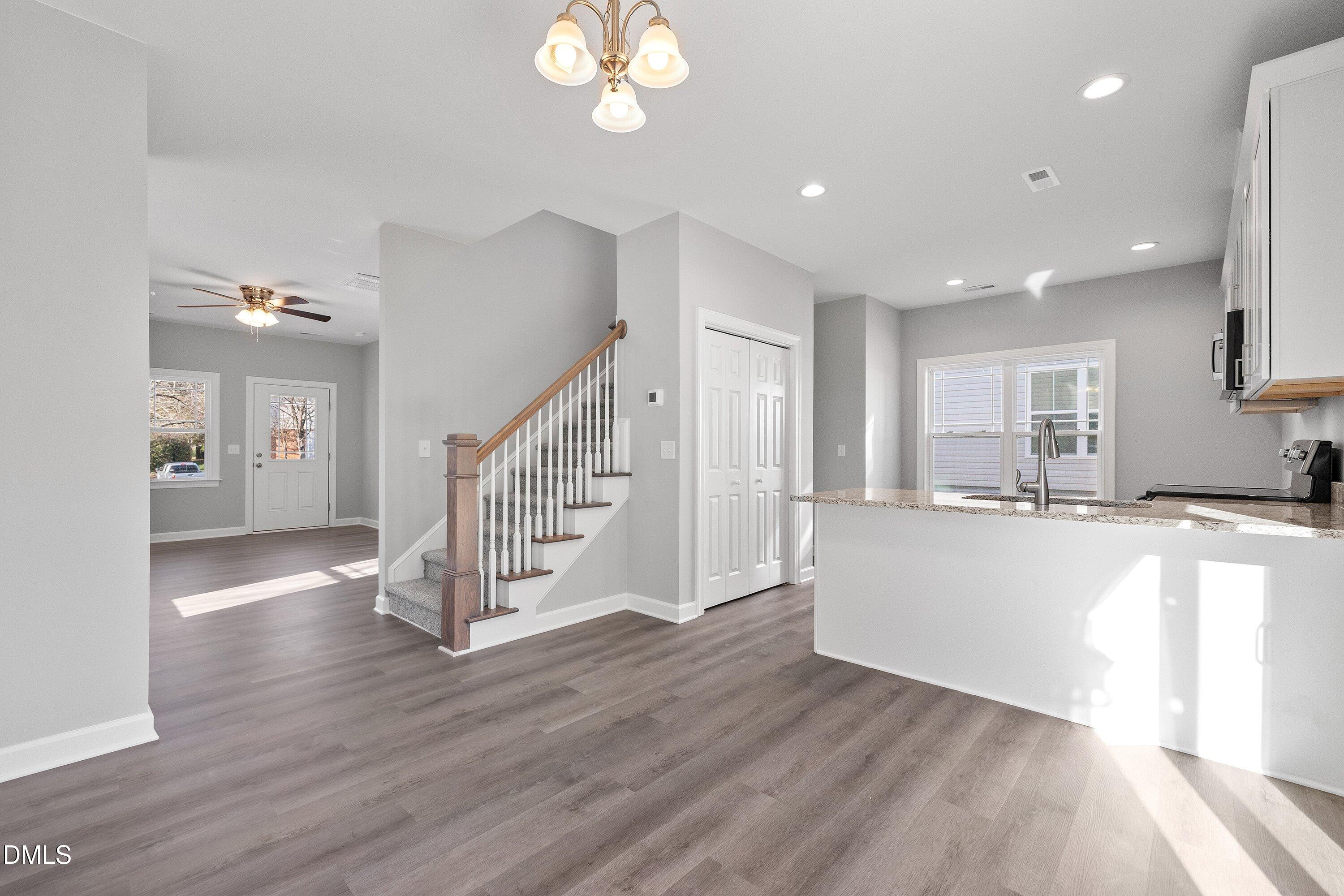 1804 Falls Landing Drive Raleigh, NC 27614 - Photo 9 of 20 a view of kitchen with wooden floor and window