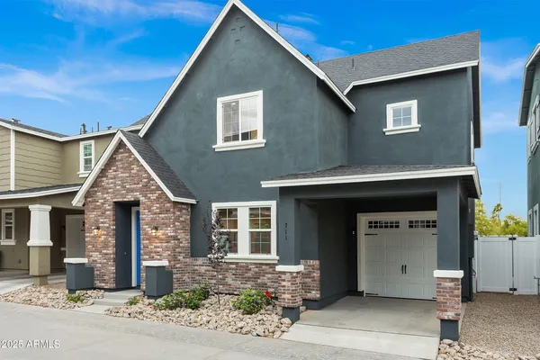 a front view of a house with garden