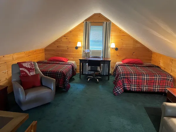 a bedroom with a bed and a couch