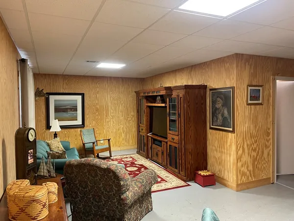 a bed room with a bed and a television