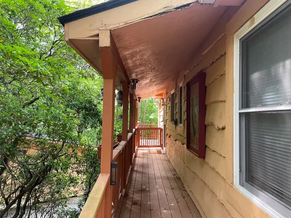 a view of balcony with wooden floor and outdoor space