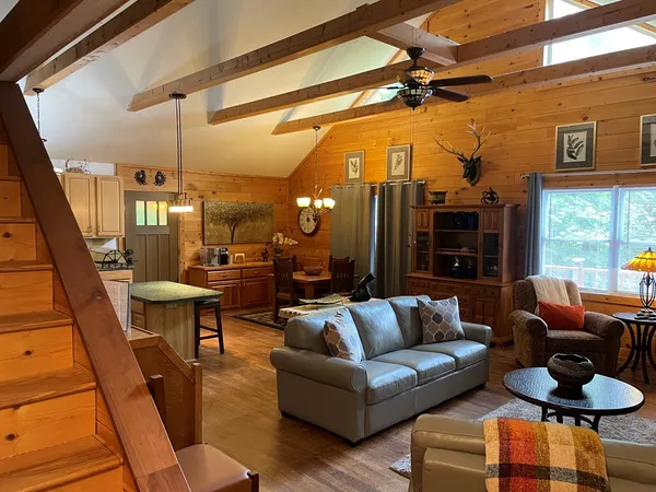 a living room with furniture and a window