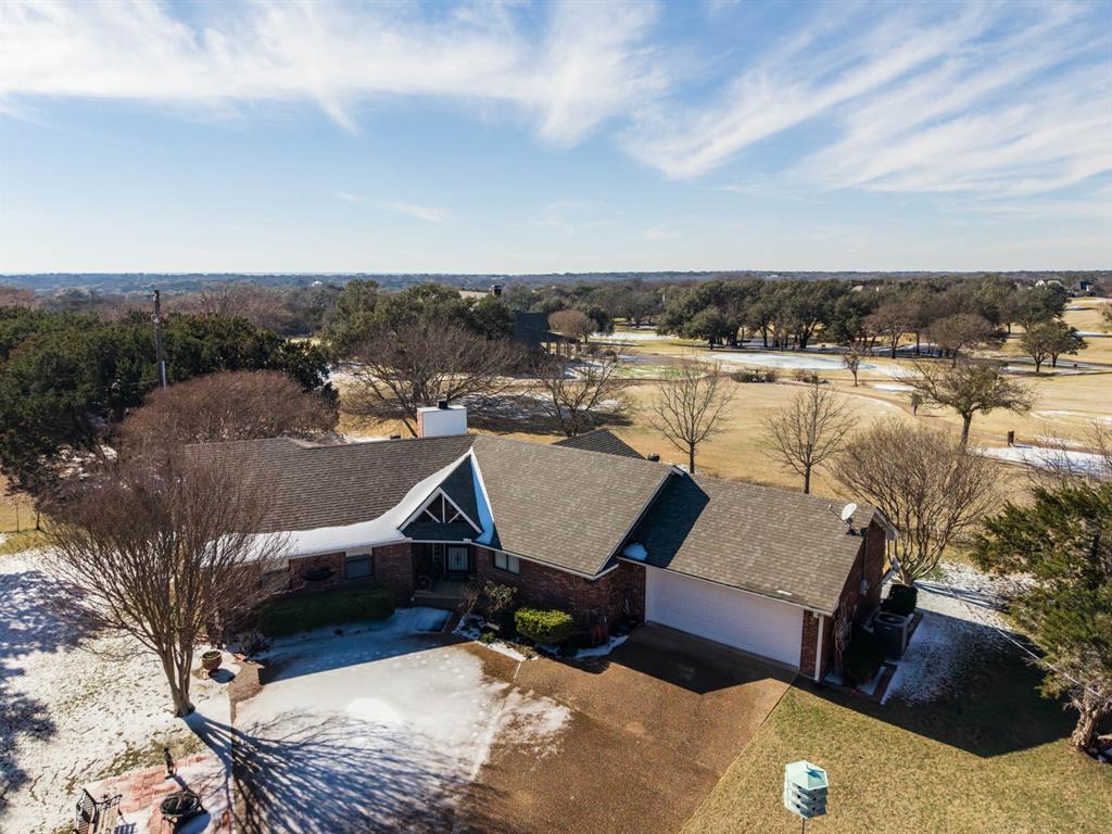 24008 Oak Shadow Whitney, TX 76692 - Photo 3 of 38 an aerial view of a house with a lake view