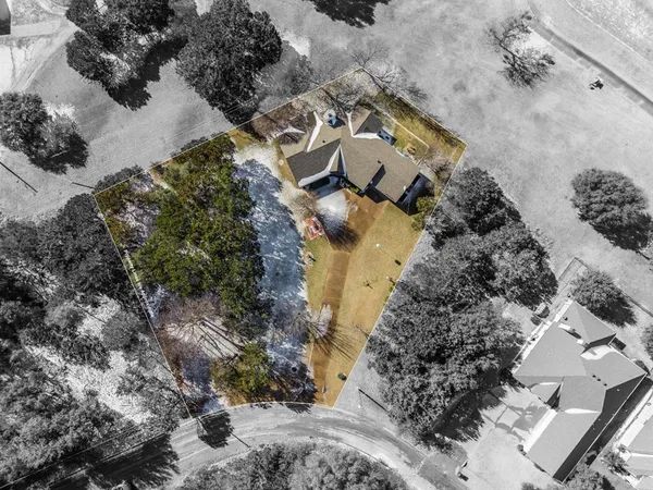 an aerial view of residential house with outdoor space