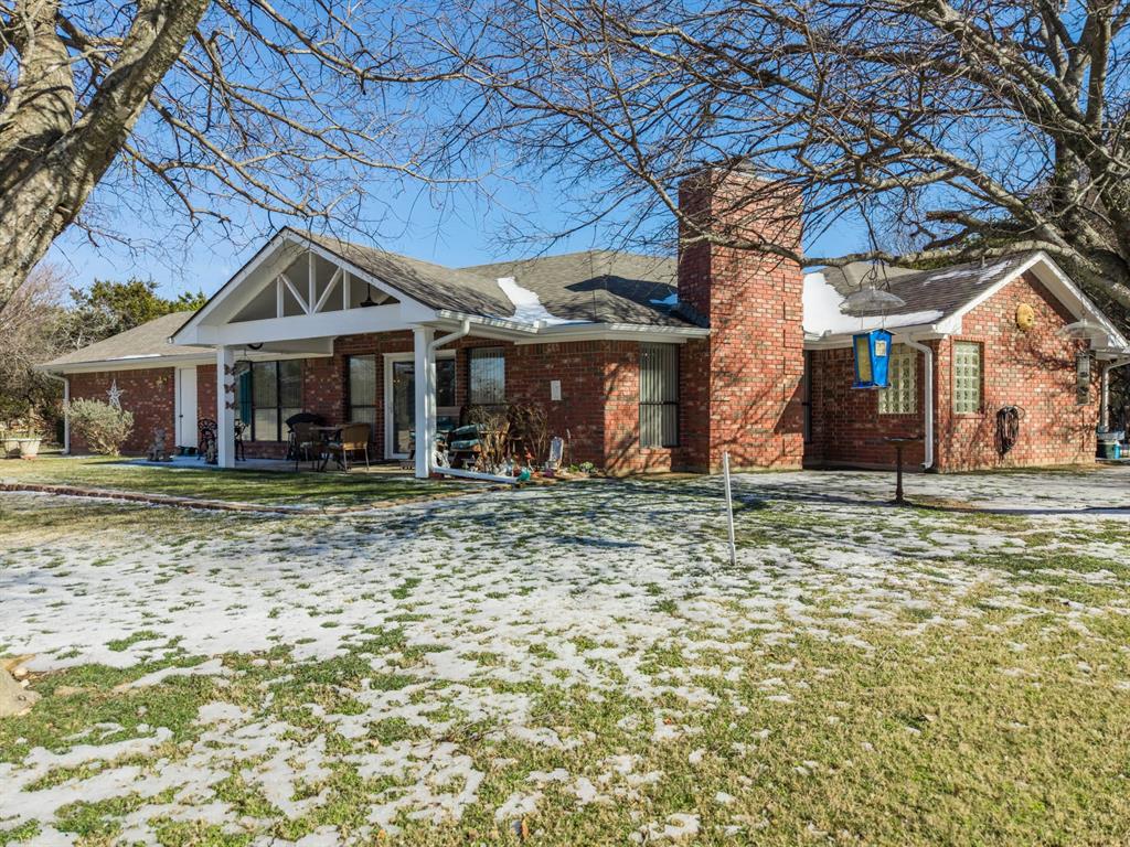 24008 Oak Shadow Whitney, TX 76692 - Photo 32 of 38 a front view of a house with garden