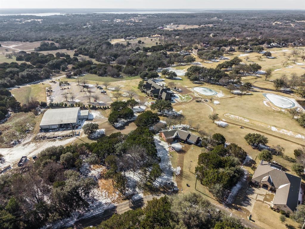 24008 Oak Shadow Whitney, TX 76692 - Photo 35 of 38 an aerial view of a city with lots of residential buildings