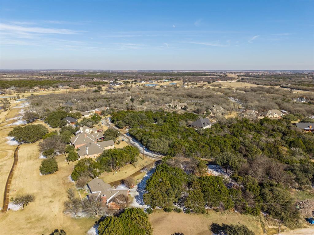 24008 Oak Shadow Whitney, TX 76692 - Photo 37 of 38 an aerial view of residential building and lake