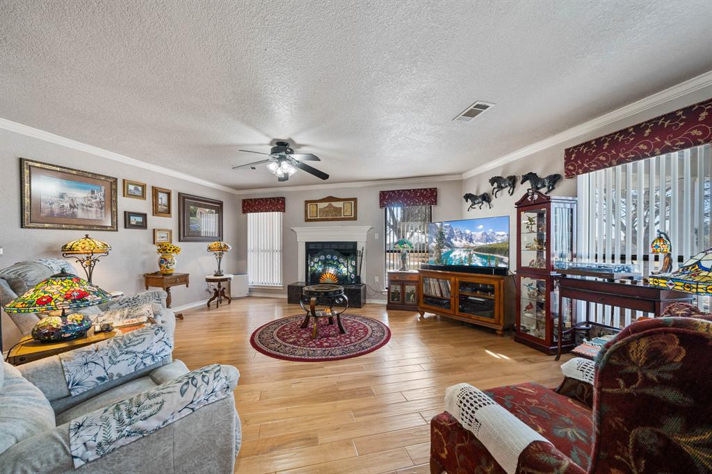24008 Oak Shadow Whitney, TX 76692 - Photo 5 of 38 a living room with furniture and a wooden floor