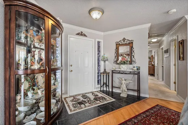 a bedroom with furniture and a rug