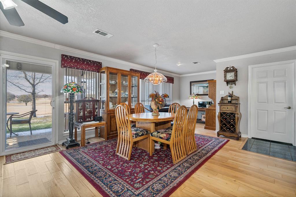 24008 Oak Shadow Whitney, TX 76692 - Photo 8 of 38 a living room with furniture large wooden floor and a rug