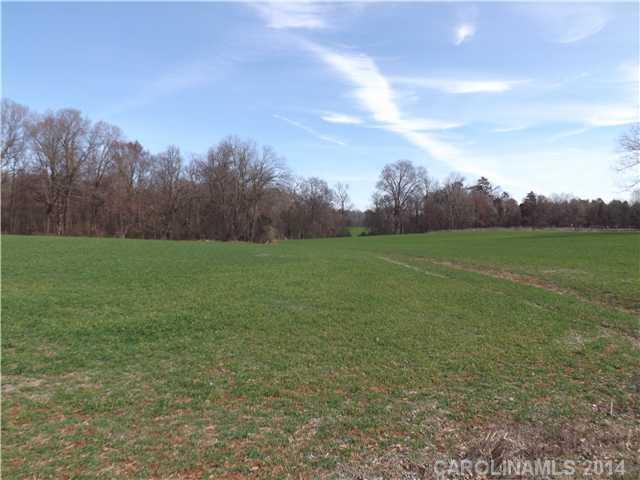 0 Justin Braswell Road Monroe, NC 28110 - Photo 3 of 6 a view of a field with an trees in back