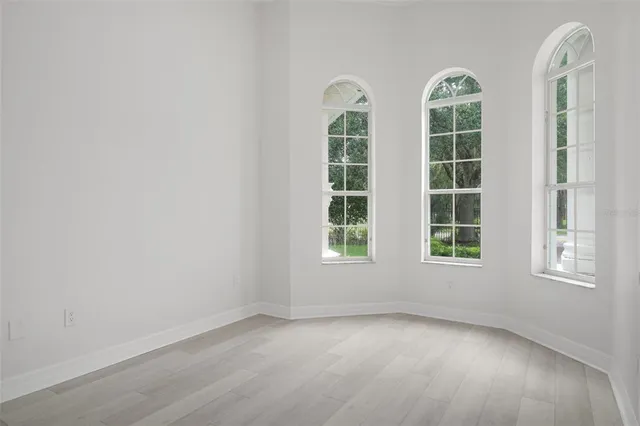 a bathroom with a sink a vanity and a large mirror