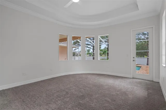 a view of a livingroom with furniture and a ceiling fan