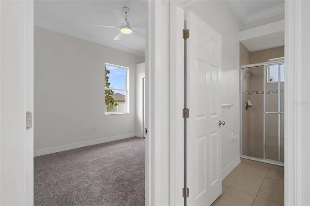 a view of swimming pool with outdoor seating and trees in the background