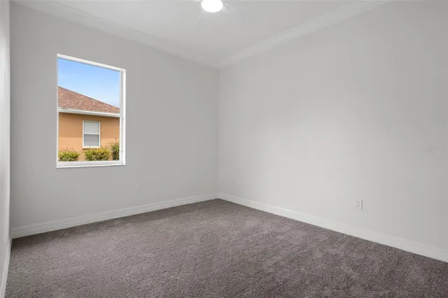 a view of swimming pool with a yard and large trees