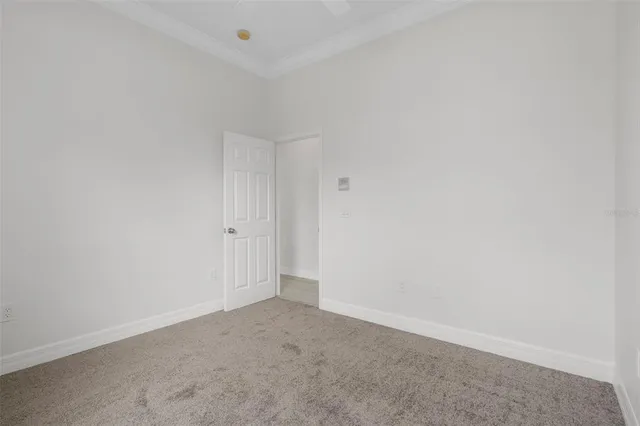a kitchen with white cabinets granite counter tops and a sink