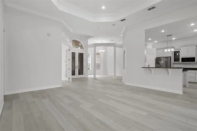 a view of an empty room with glass door