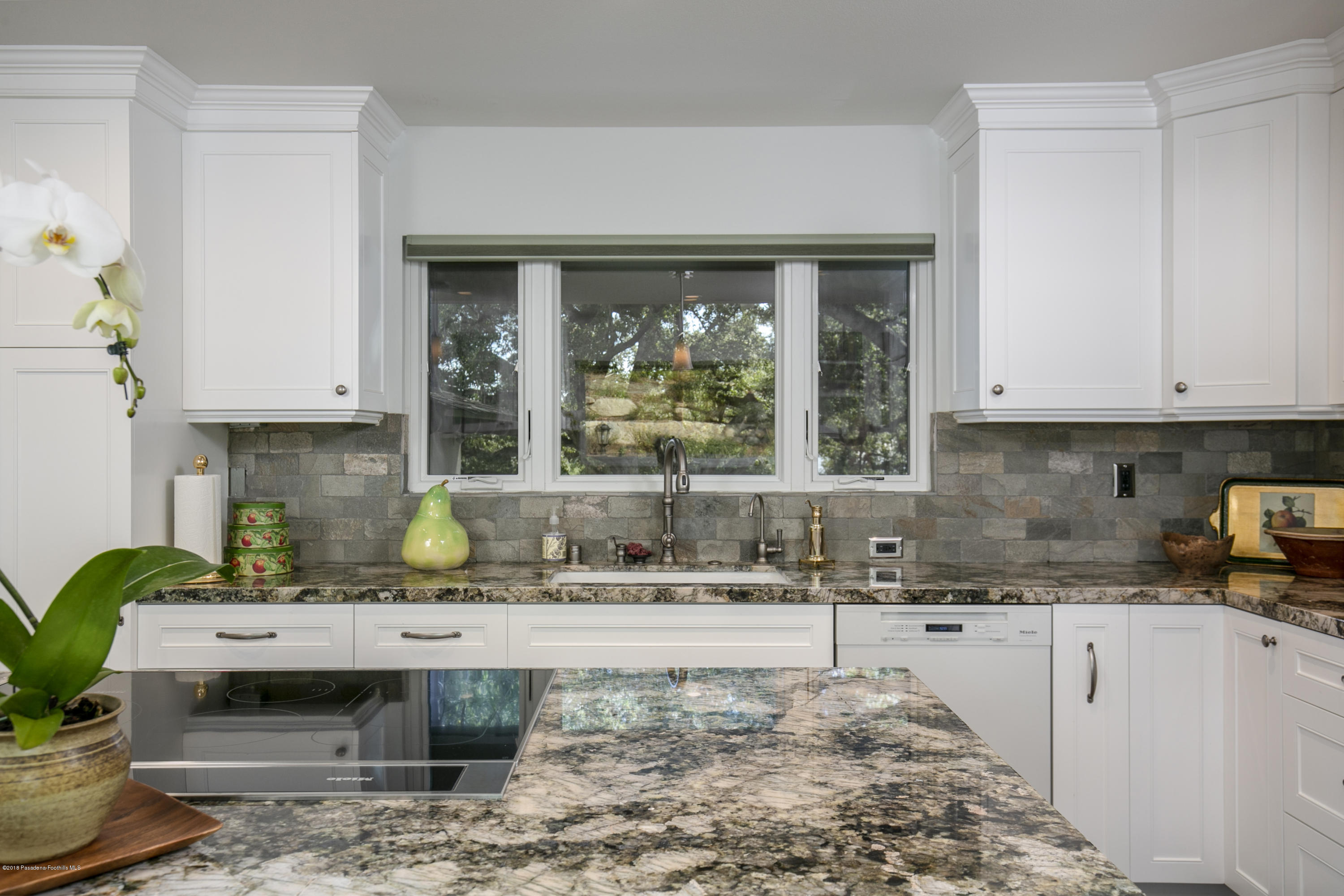 2031 Windover Road Pasadena, CA 91107 - Photo 12 of 56 a kitchen with a sink and cabinets