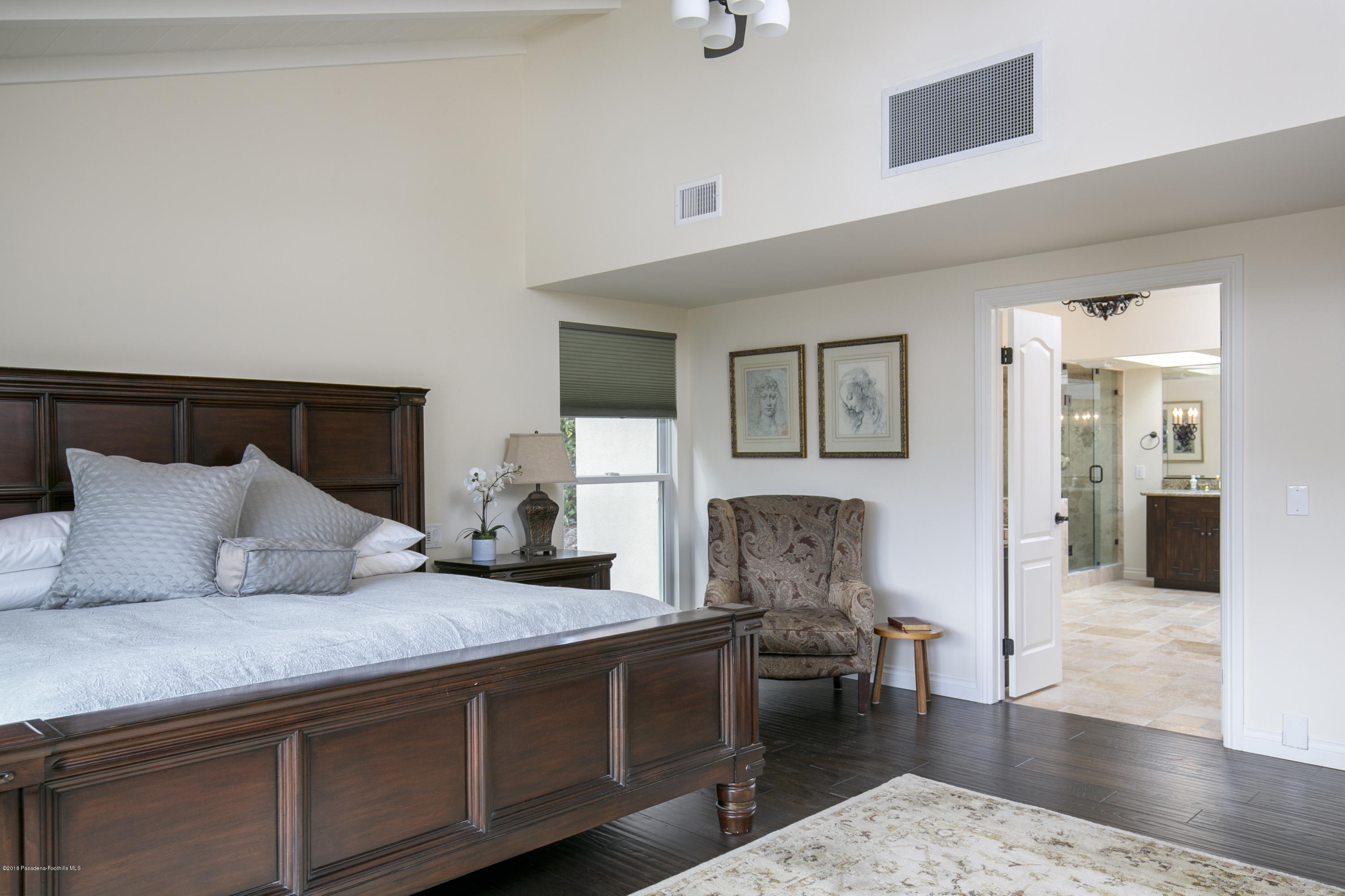 2031 Windover Road Pasadena, CA 91107 - Photo 14 of 56 a spacious bedroom with a large bed and a couch