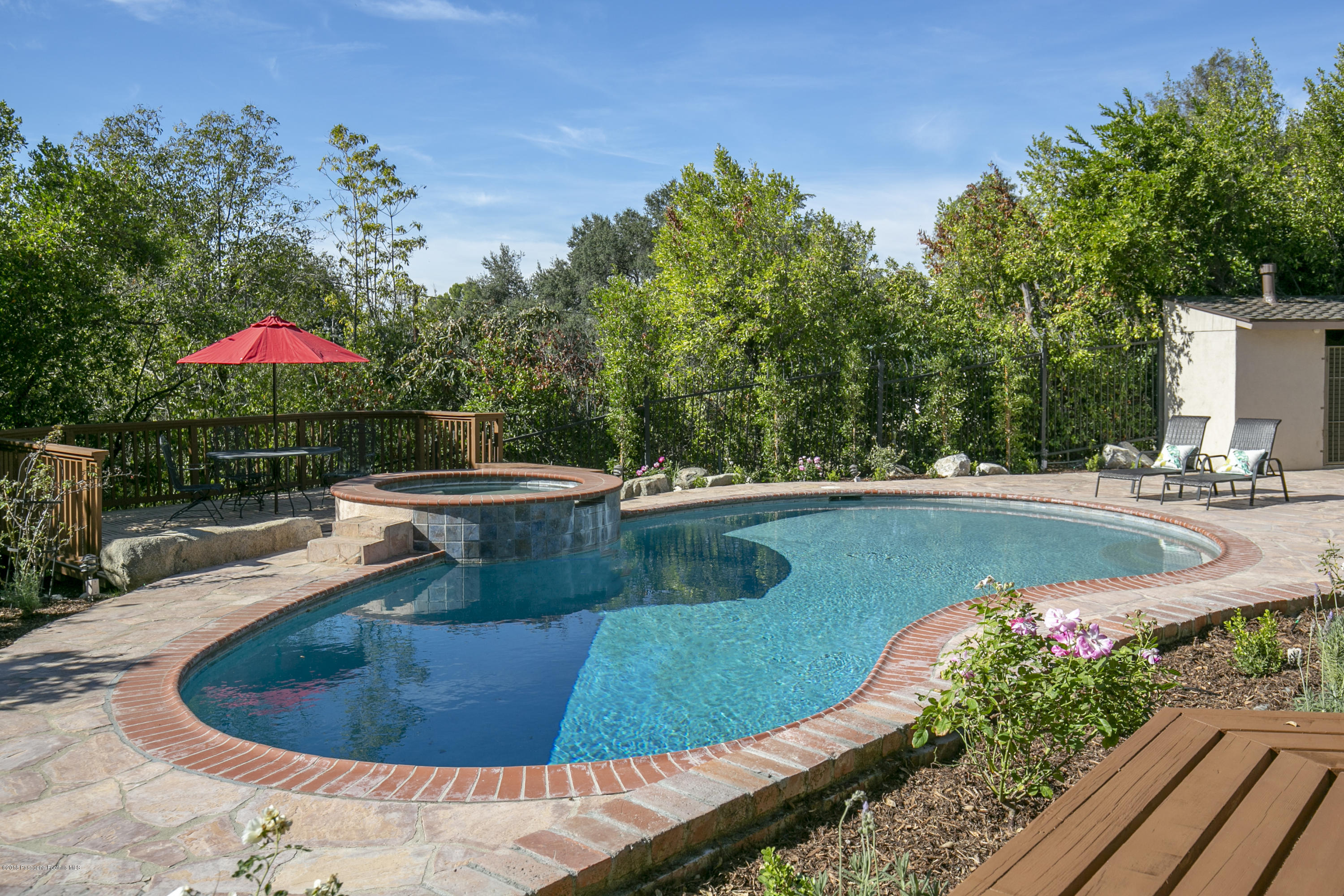 2031 Windover Road Pasadena, CA 91107 - Photo 35 of 56 a view of a swimming pool with a patio