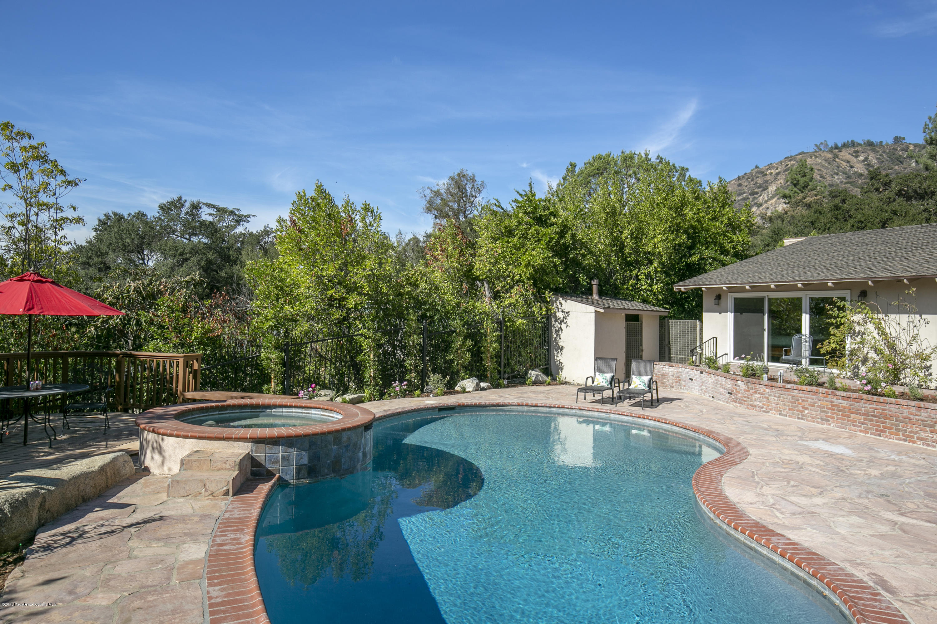 2031 Windover Road Pasadena, CA 91107 - Photo 38 of 56 a view of a swimming pool with a patio