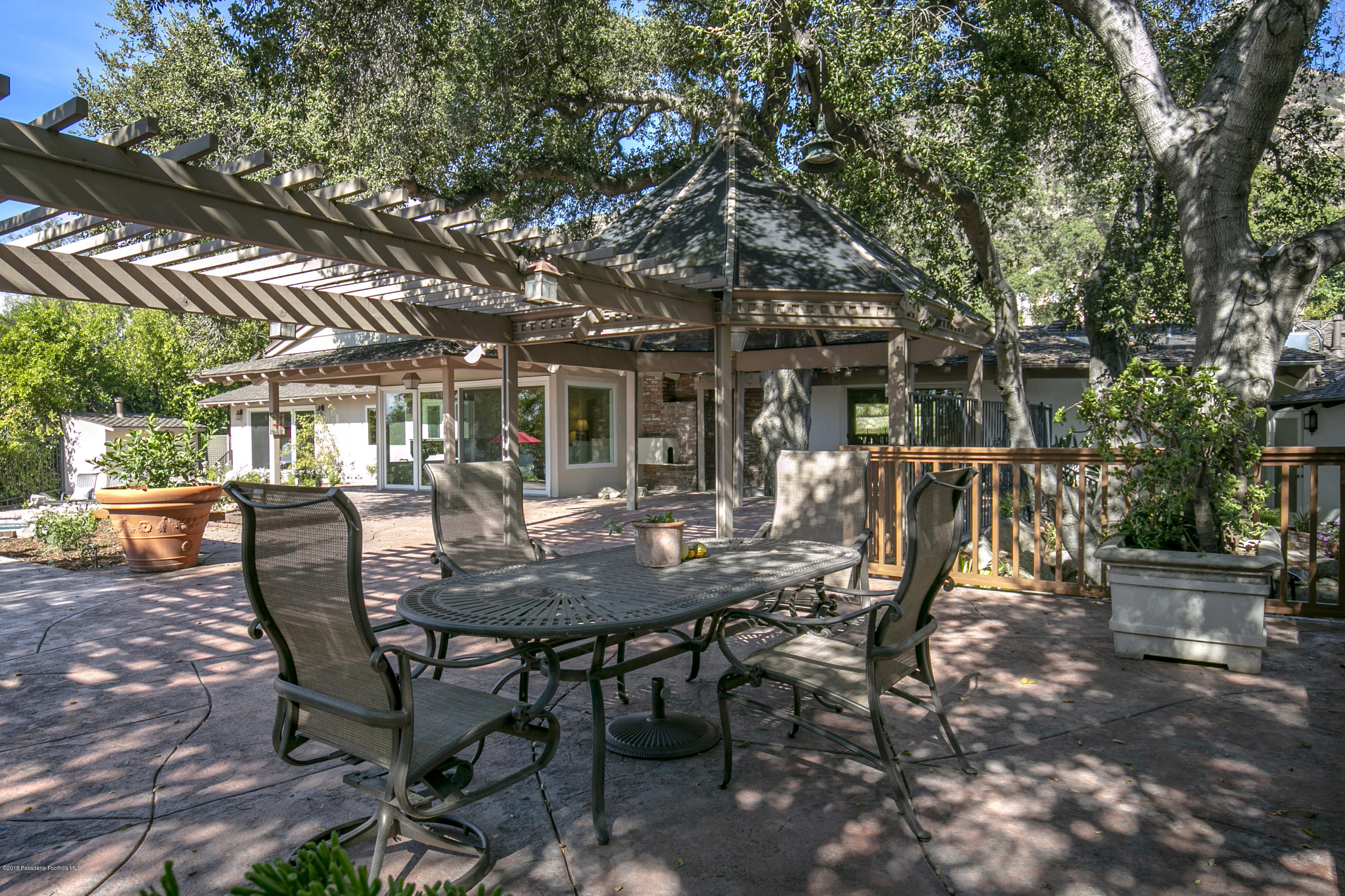 2031 Windover Road Pasadena, CA 91107 - Photo 41 of 56 a view of a patio with table and chairs and potted plants