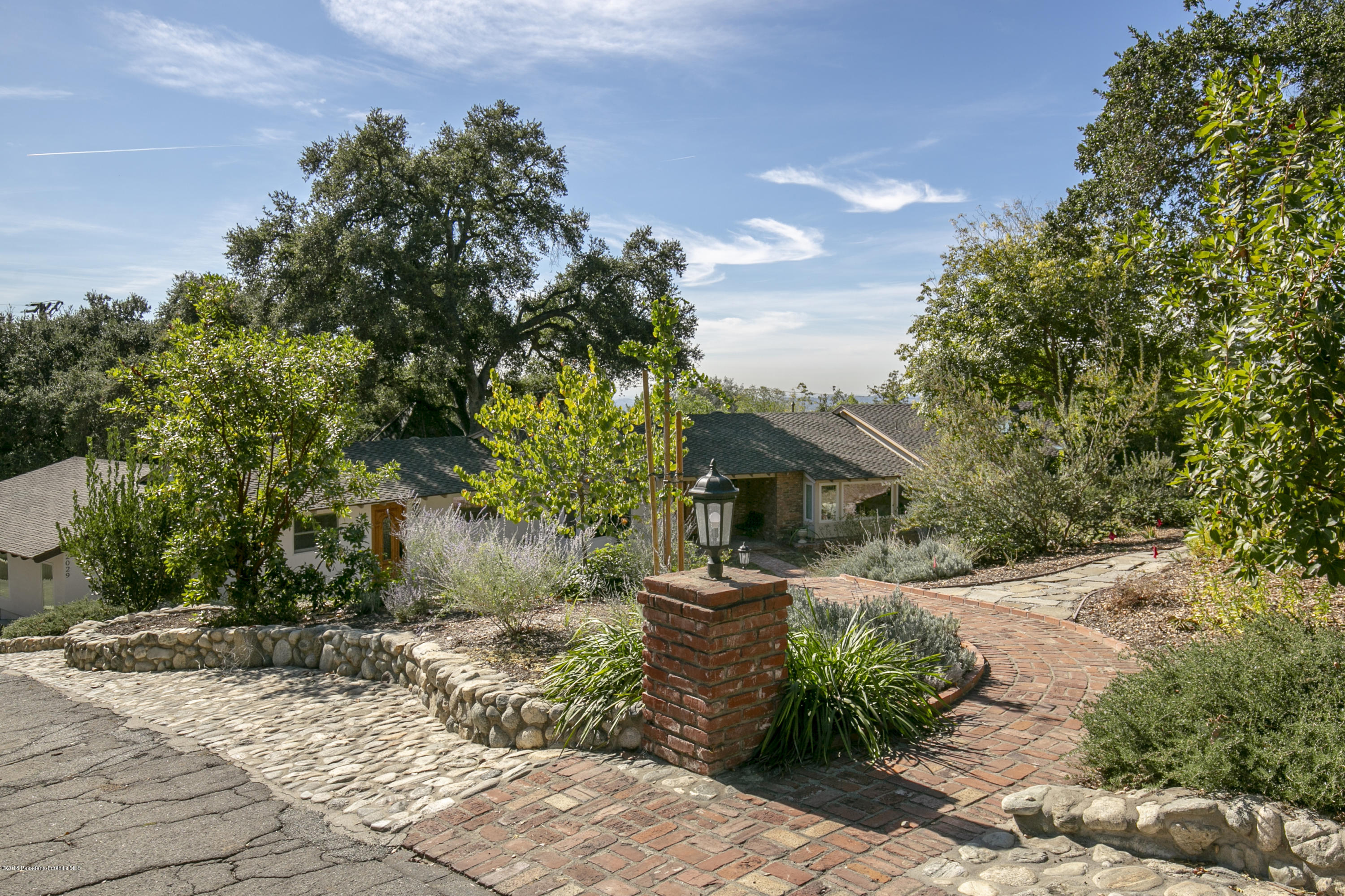2031 Windover Road Pasadena, CA 91107 - Photo 46 of 56 a front view of a house with garden