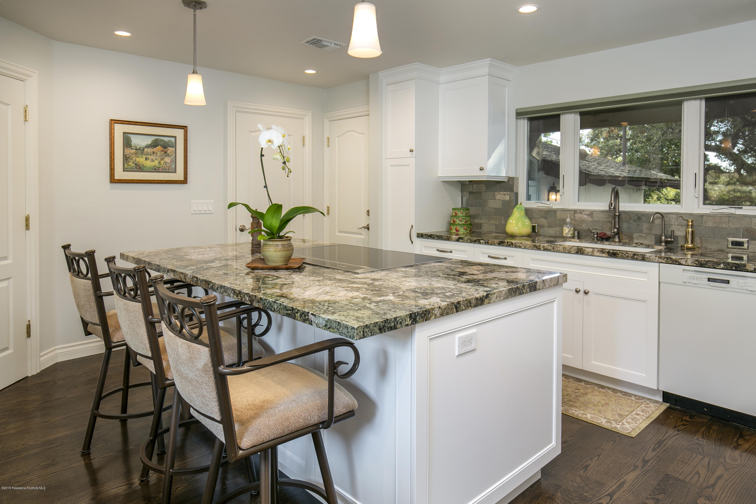 2031 Windover Road Pasadena, CA 91107 - Photo 9 of 56 a kitchen with a table chairs sink and cabinets