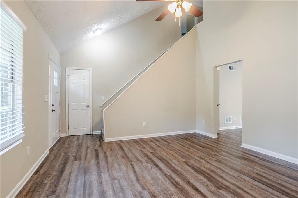 3822 Conley Downs Lane Decatur, GA 30034 - Photo 11 of 46 wooden floor in an empty room with a window