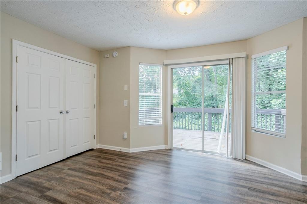 3822 Conley Downs Lane Decatur, GA 30034 - Photo 15 of 46 a view of an empty room with wooden floor and a window