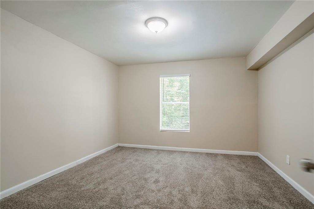 3822 Conley Downs Lane Decatur, GA 30034 - Photo 18 of 46 an empty room with a window