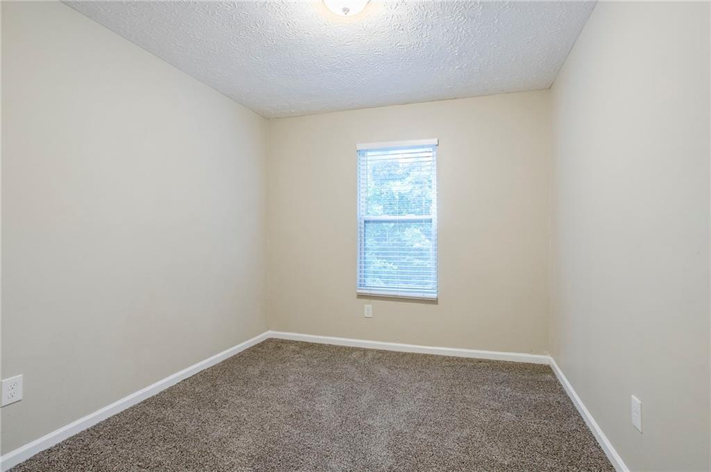 3822 Conley Downs Lane Decatur, GA 30034 - Photo 23 of 46 an empty room with a window