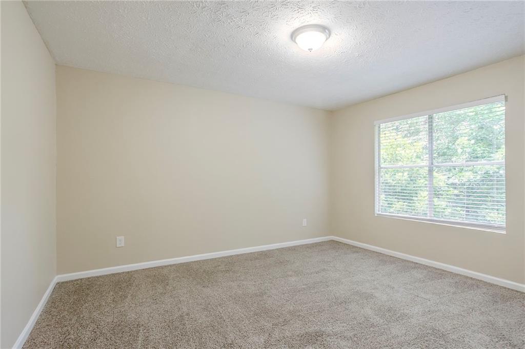 3822 Conley Downs Lane Decatur, GA 30034 - Photo 26 of 46 an empty room with a window