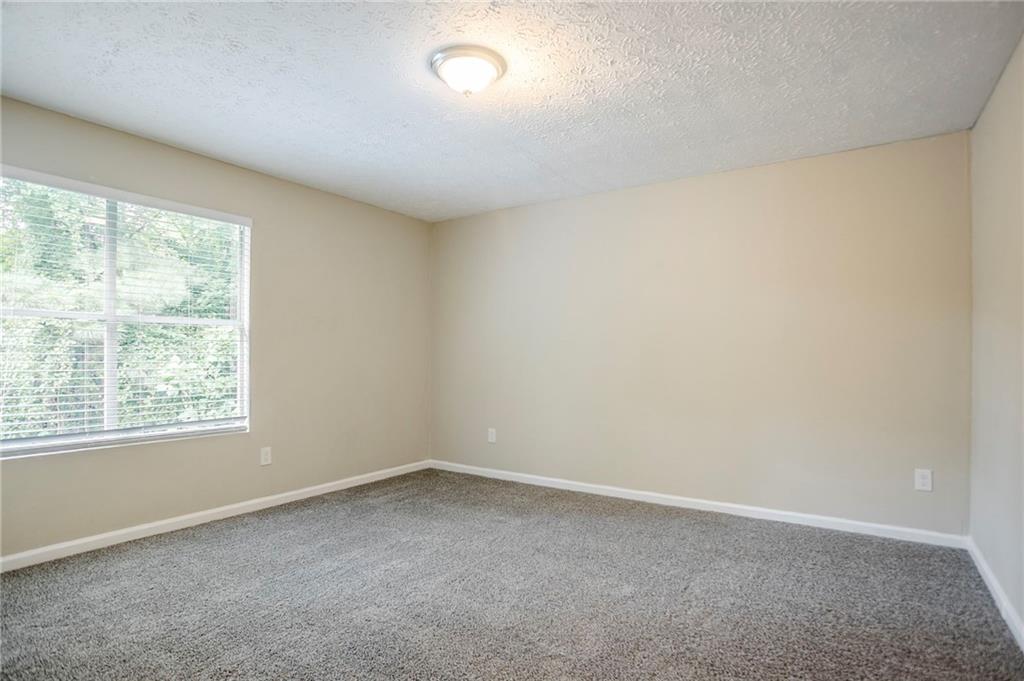 3822 Conley Downs Lane Decatur, GA 30034 - Photo 28 of 46 an empty room with a window