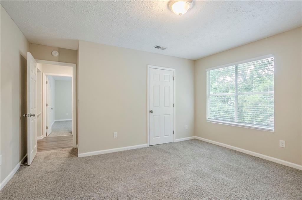 3822 Conley Downs Lane Decatur, GA 30034 - Photo 29 of 46 a view of an empty room with a window