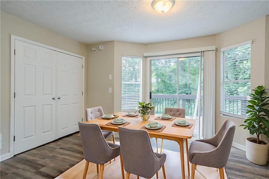 3822 Conley Downs Lane Decatur, GA 30034 - Photo 5 of 46 a view of a dining room with furniture window and wooden floor