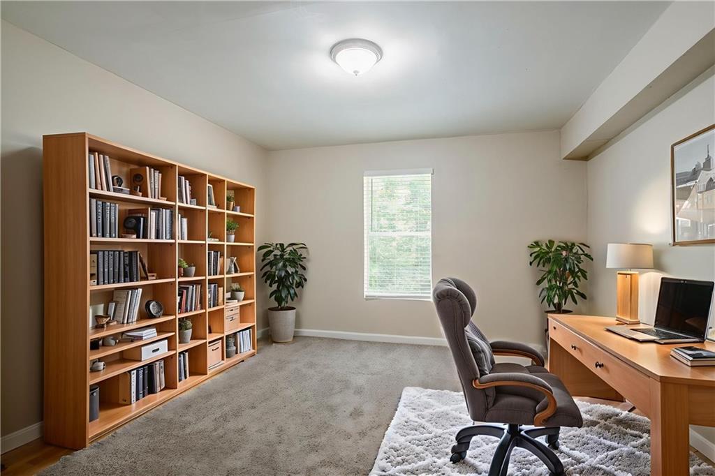 3822 Conley Downs Lane Decatur, GA 30034 - Photo 7 of 46 a view of a workspace with furniture and a bookshelf