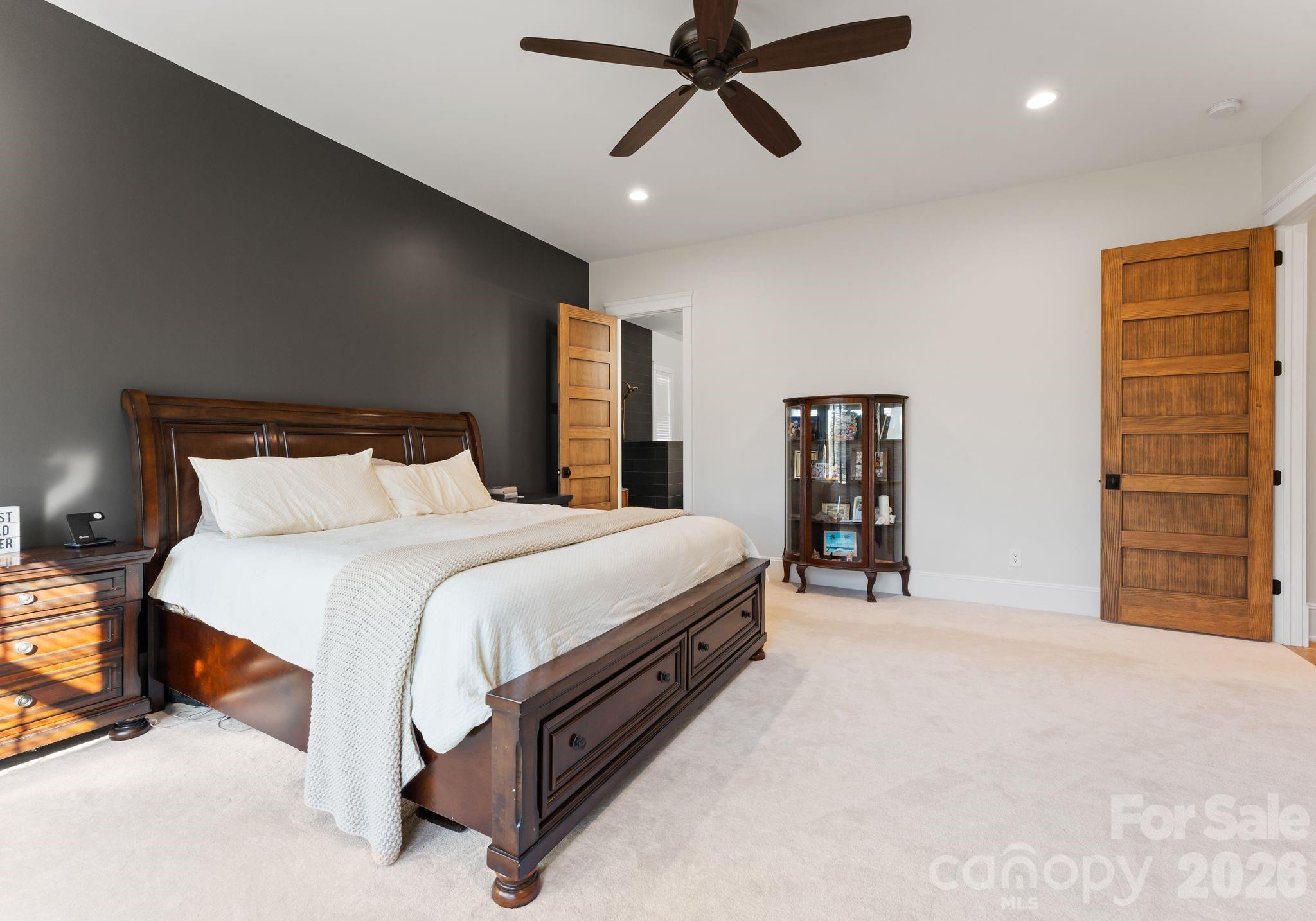 3760 Cappadocia Church Road Polkton, NC 28135 - Photo 21 of 48 a spacious bedroom with a bed and a ceiling fan