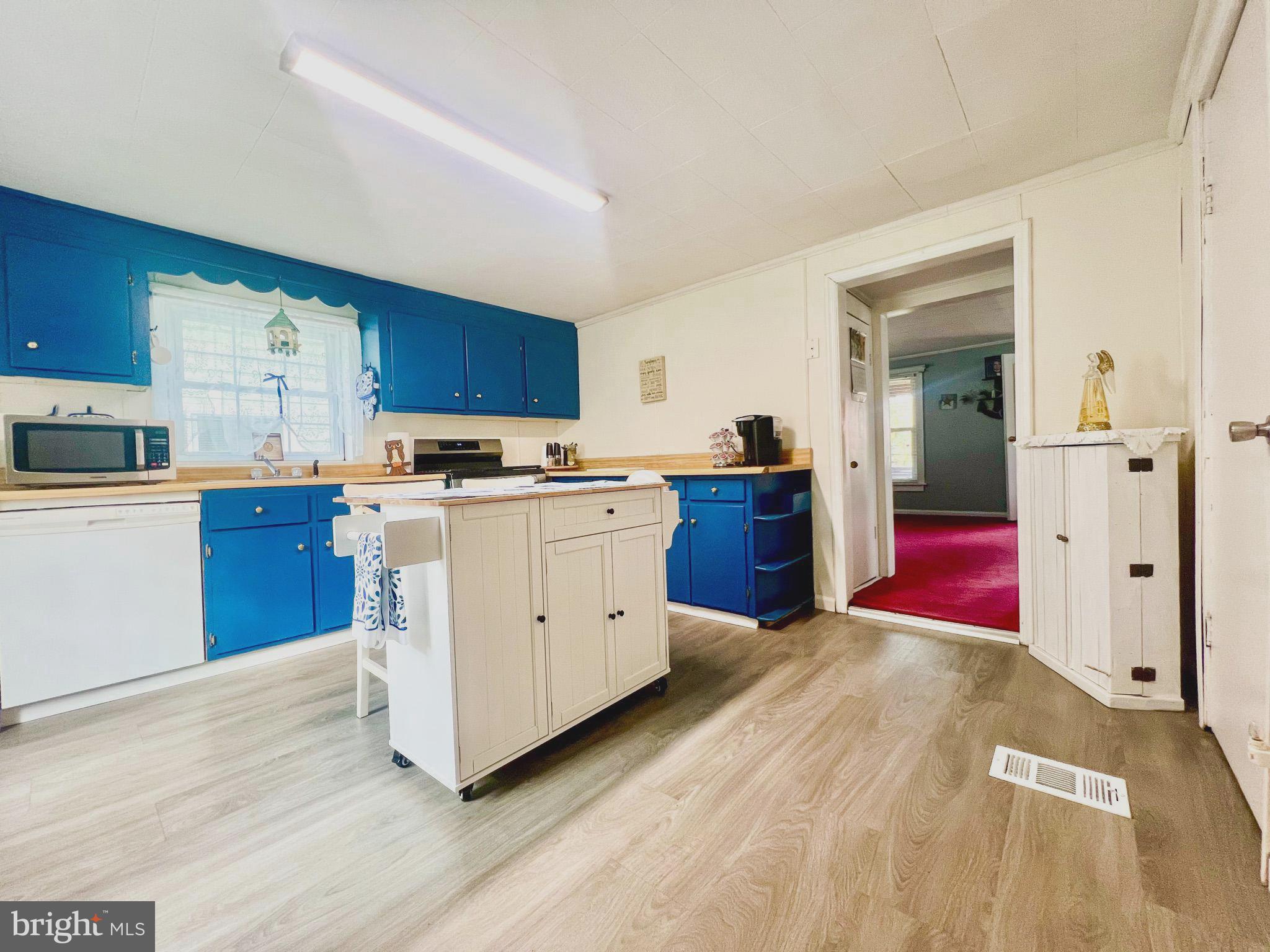 413 Walker Street Osceola Mills, PA 16666 - Photo 11 of 26 a kitchen with stainless steel appliances granite countertop a stove sink and cabinets
