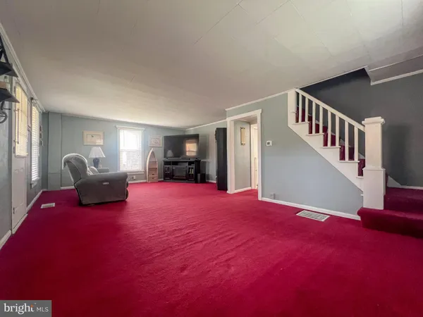a bed room with furniture and a window