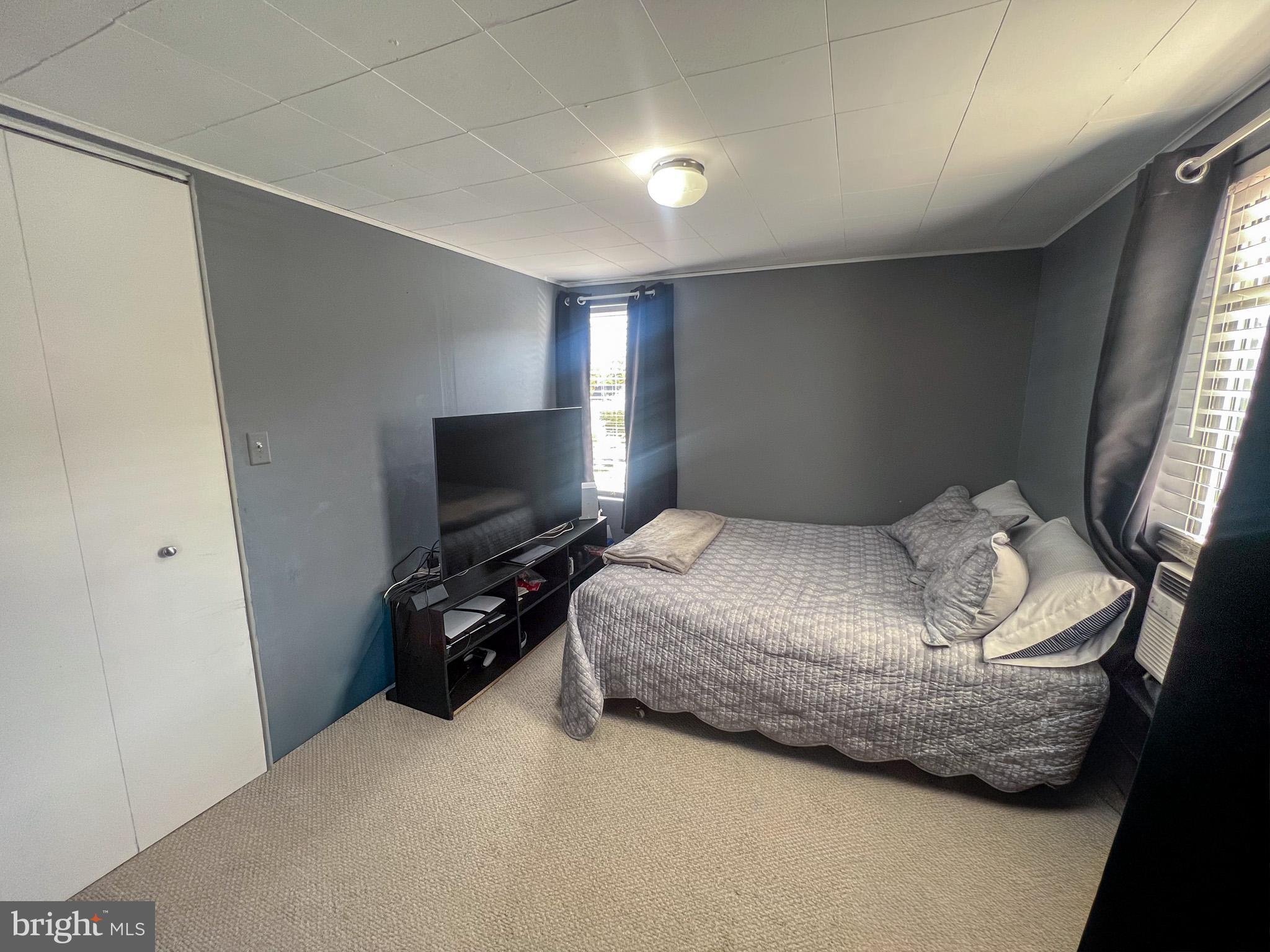 413 Walker Street Osceola Mills, PA 16666 - Photo 17 of 26 a bedroom with a bed and a flat screen tv