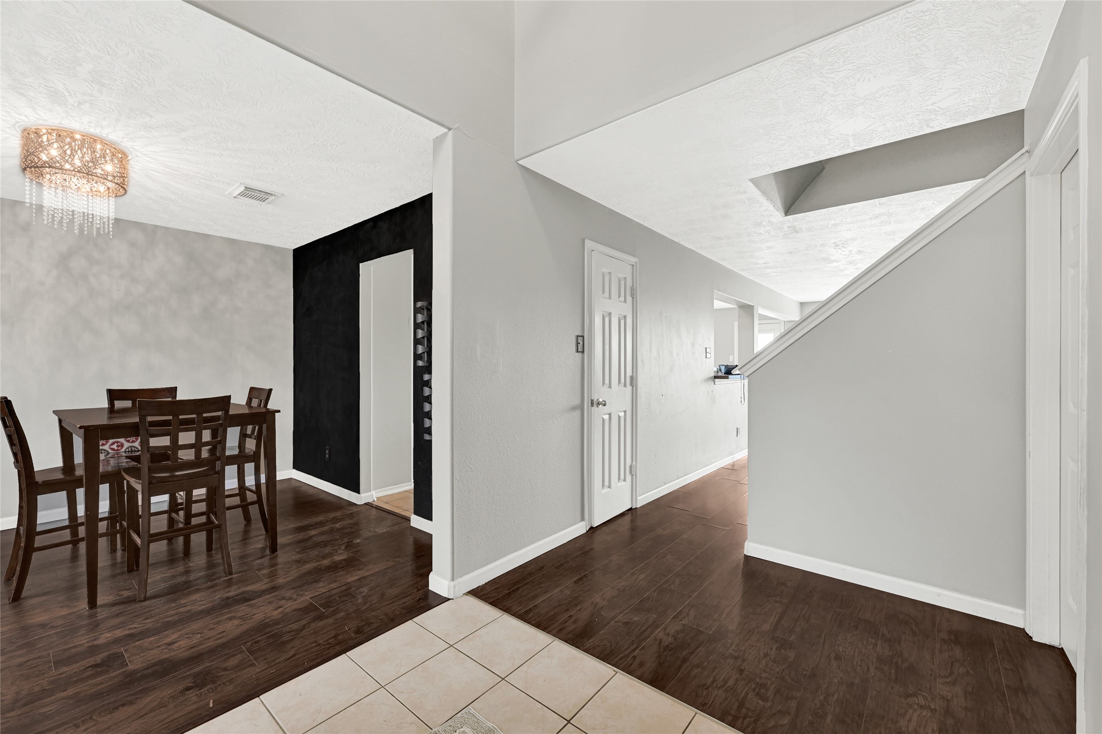 5707 Meadow Breeze Lane Rosharon, TX 77583 - Photo 3 of 26 a view of a dining room with furniture and wooden floor