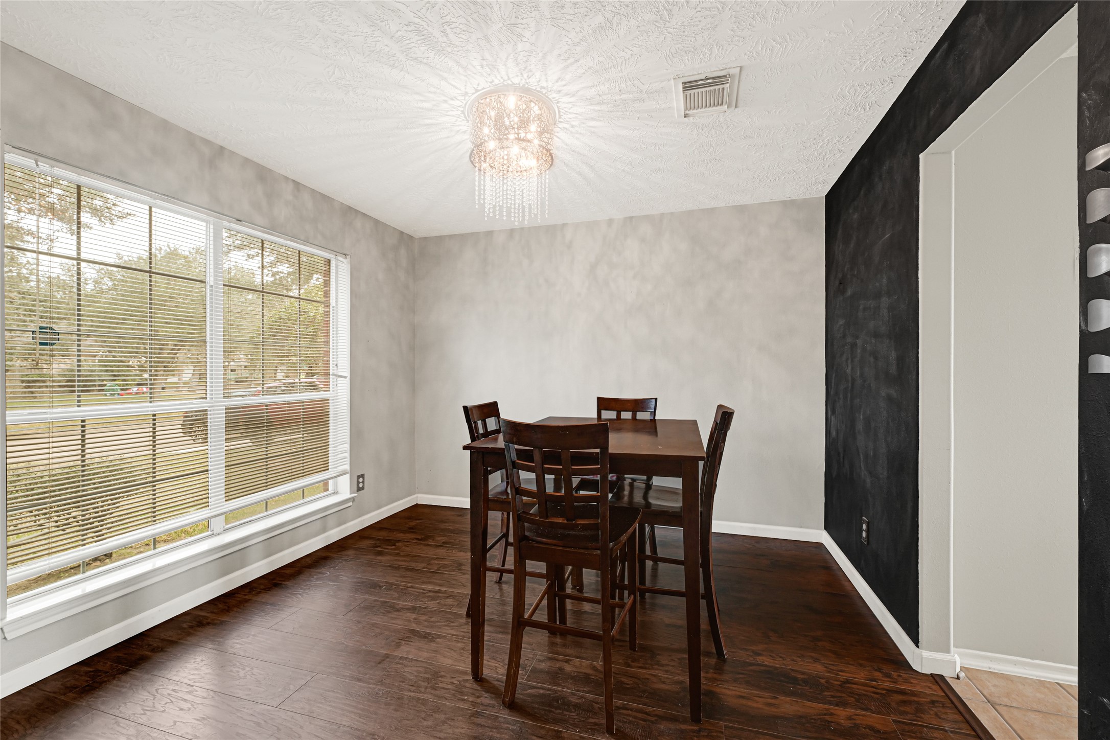 5707 Meadow Breeze Lane Rosharon, TX 77583 - Photo 5 of 26 a view of a dining room with furniture and wooden floor