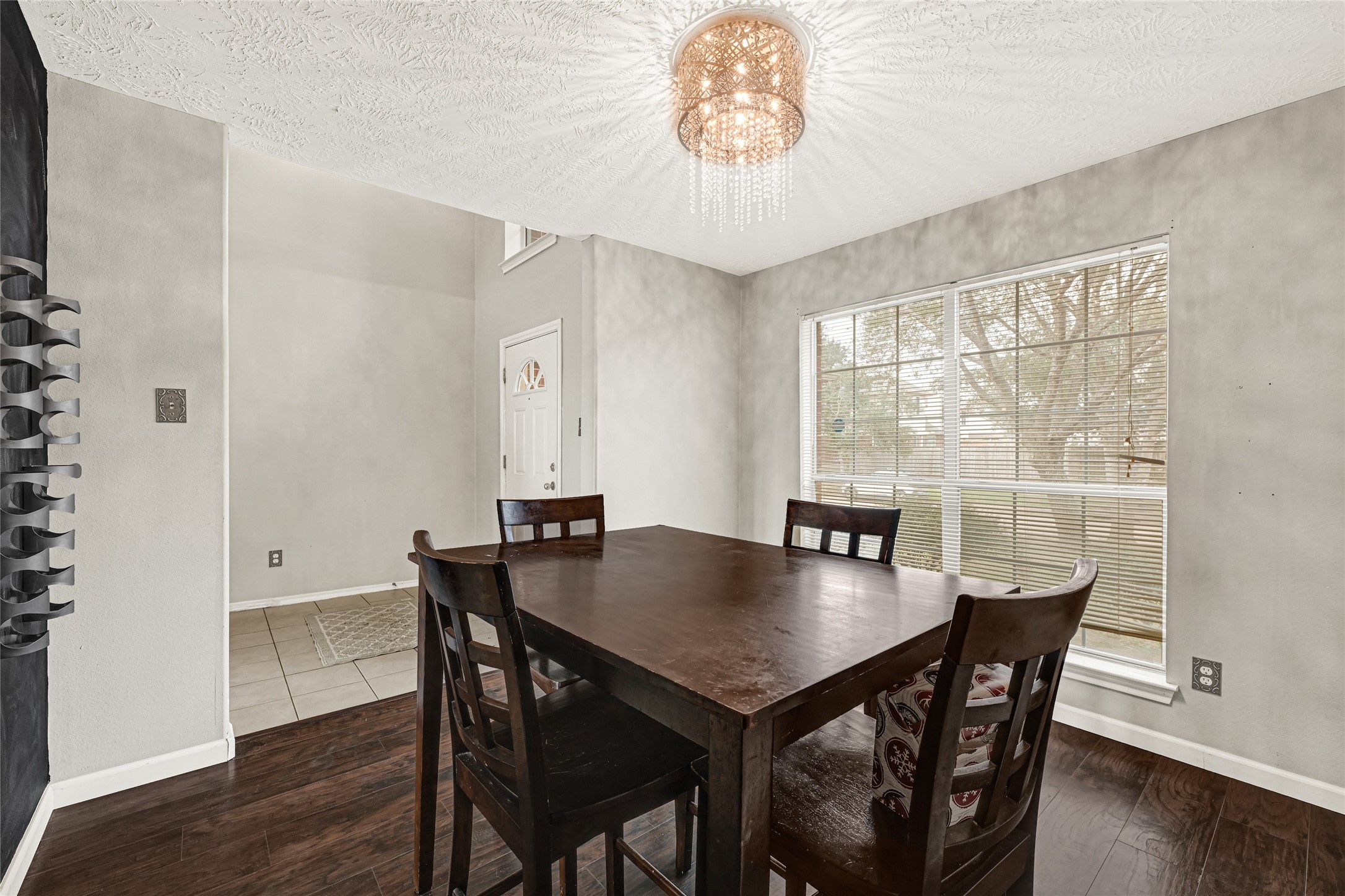 5707 Meadow Breeze Lane Rosharon, TX 77583 - Photo 6 of 26 a view of a dining room with furniture window and wooden floor