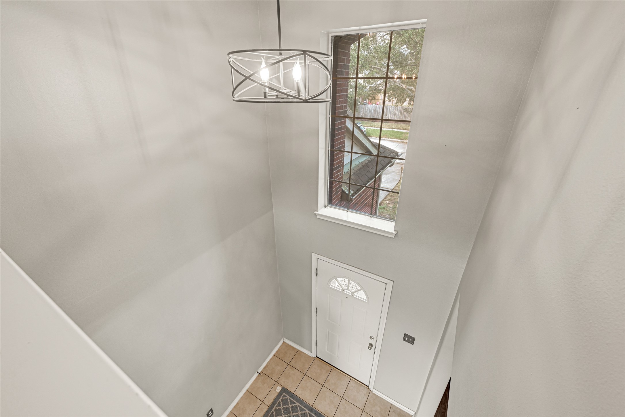 5707 Meadow Breeze Lane Rosharon, TX 77583 - Photo 7 of 26 an empty room with wooden floor and windows