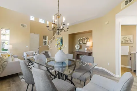 a kitchen with a refrigerator and a stove