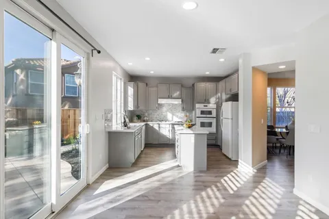 a view of an entryway with wooden floor