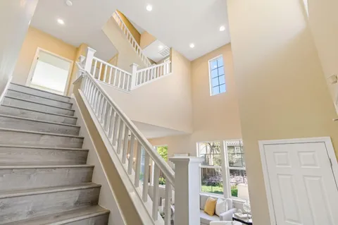 a bedroom with a large bed and a large window