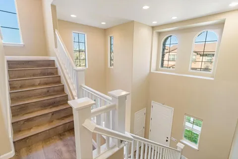 a bedroom with a bed and a chair