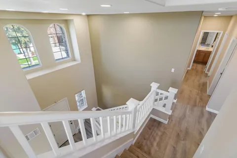 a bedroom with a bed and a chair